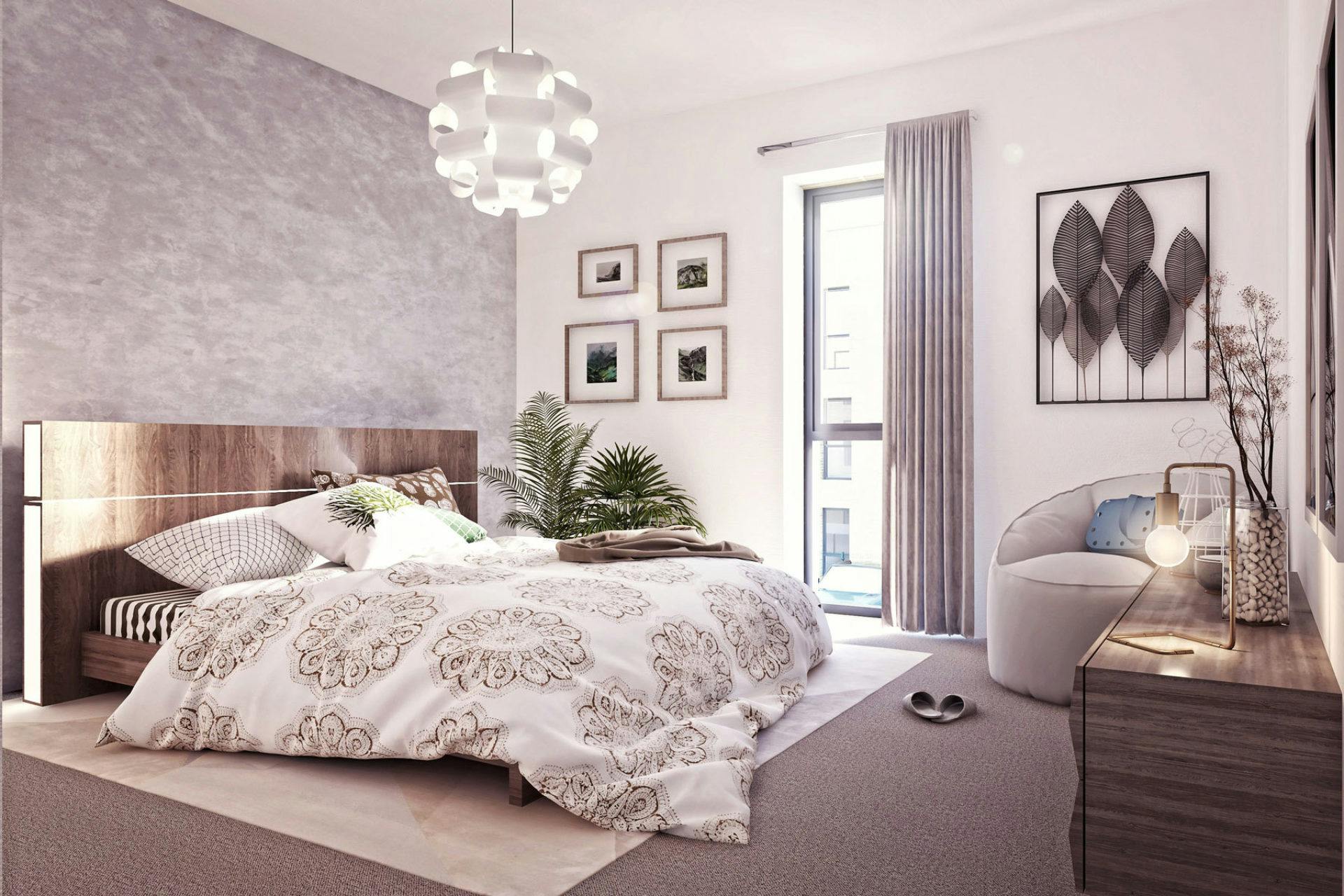 Elegant bedroom with a plush bed, patterned bedding, a modern spherical chandelier, and tasteful wall art.