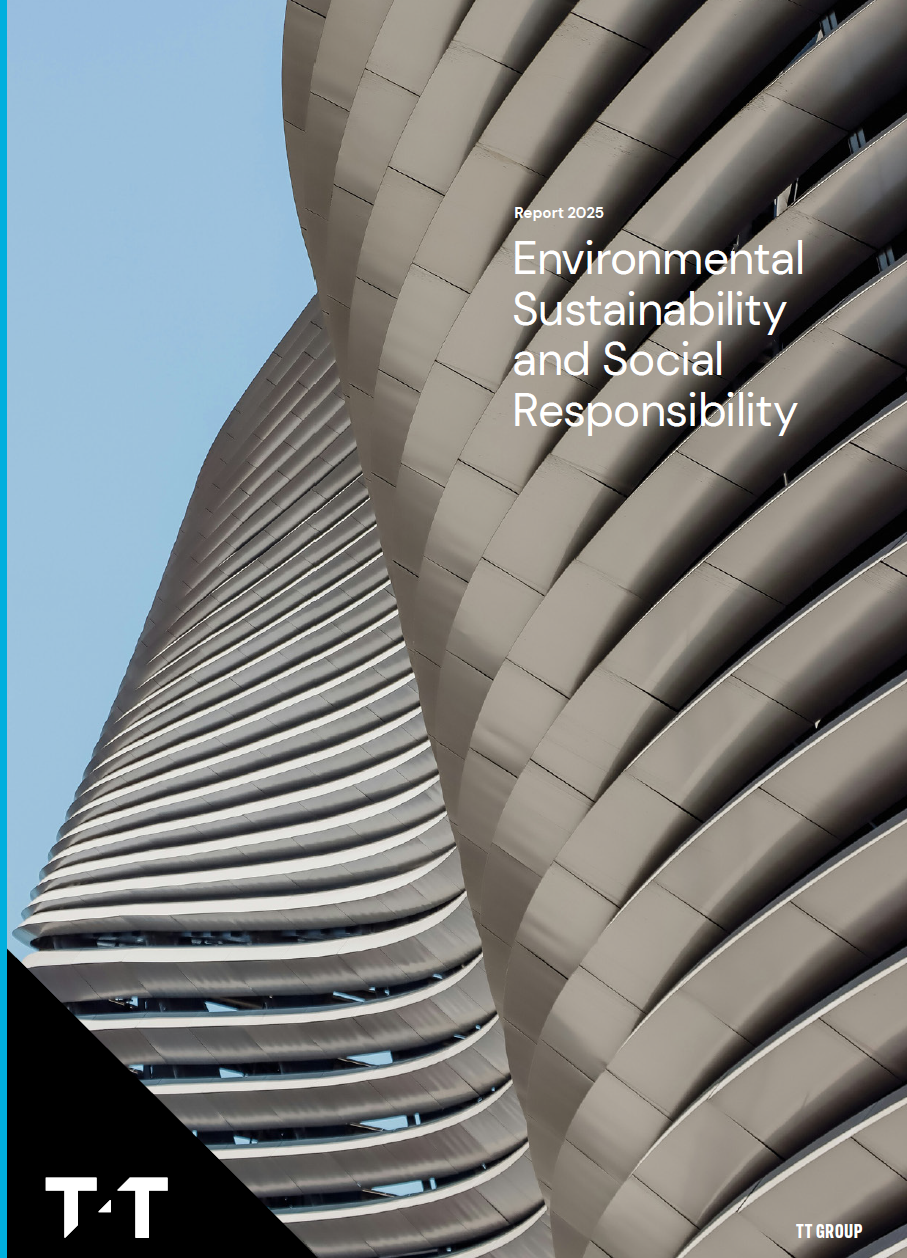 Modern building with curved grey metal panels creating repetitive horizontal lines against blue sky. White text reads "Environmental Sustainability and Social Responsibility Report 2025" with TT Group logo.