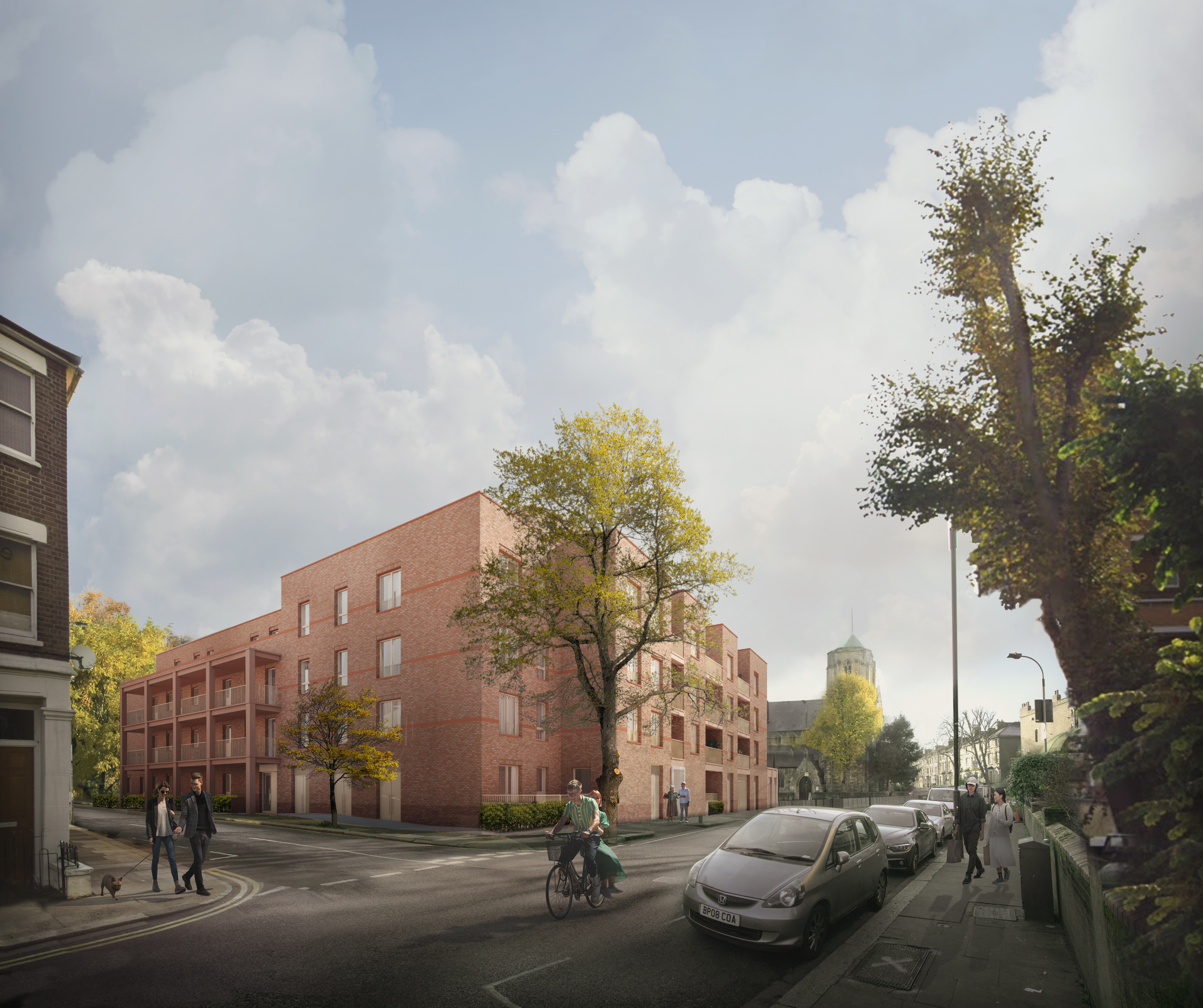 Street view of a modern, red-brick residential building on a tree-lined corner, with cars and pedestrians nearby.