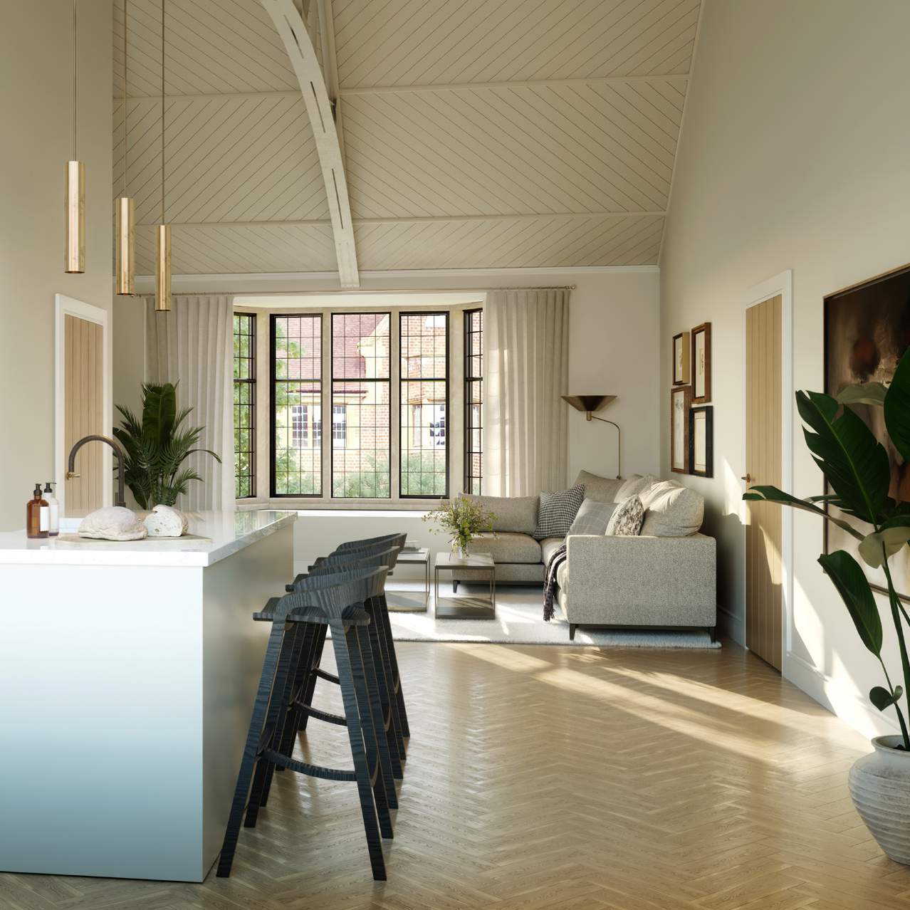 Bright, modern living room with vaulted ceilings, a kitchen island with bar stools, and a cozy seating area near large windows.